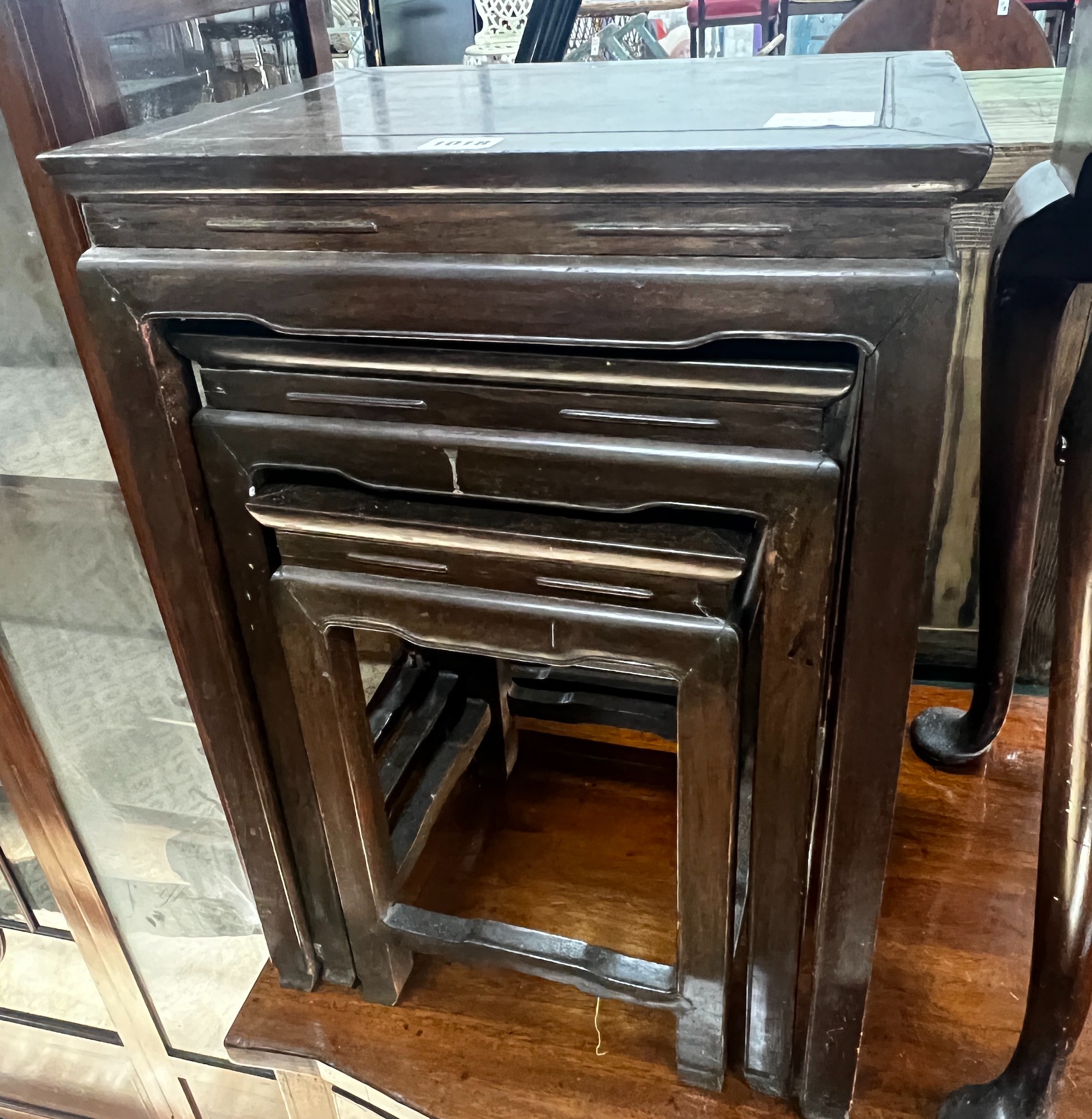 A nest of three Chinese hardwood tables, width 41cm, depth 32cm, height 59cm